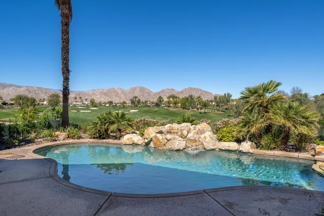 a view of a garden with a lake