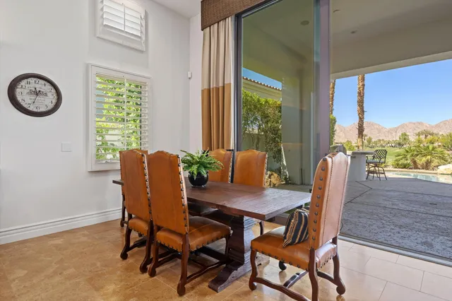 a bedroom with a large bed and a tv