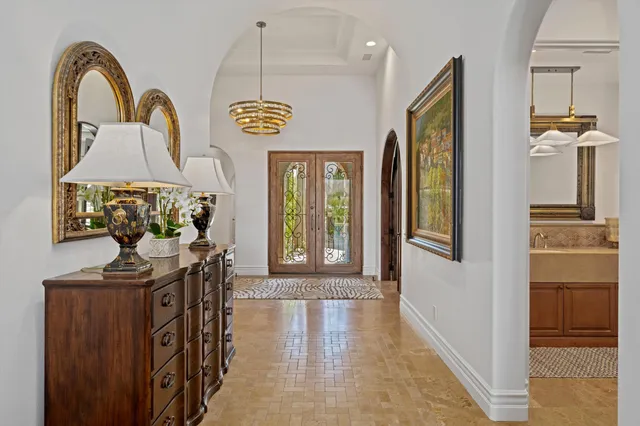 a spacious bathroom with a tub sink and mirror