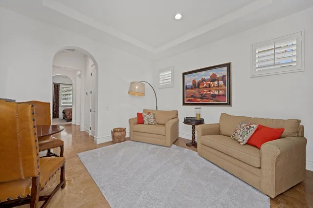 a front view of a house with outdoor seating