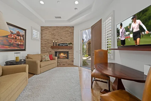 a front view of a house with a yard and a garden