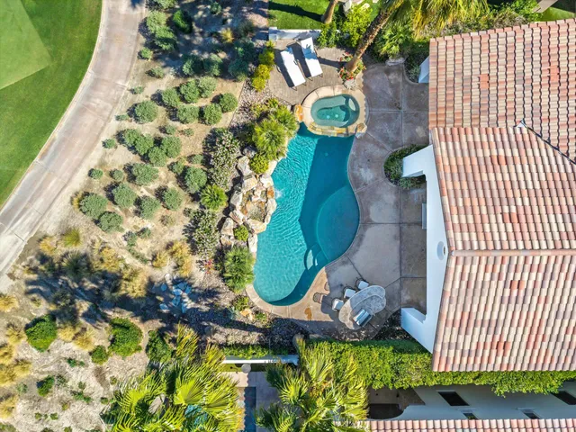 a view of a swimming pool with a garden