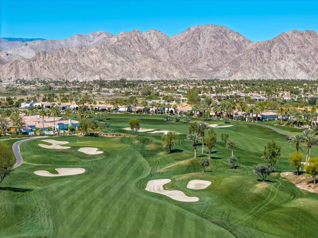 a view of swimming pool with outdoor seating