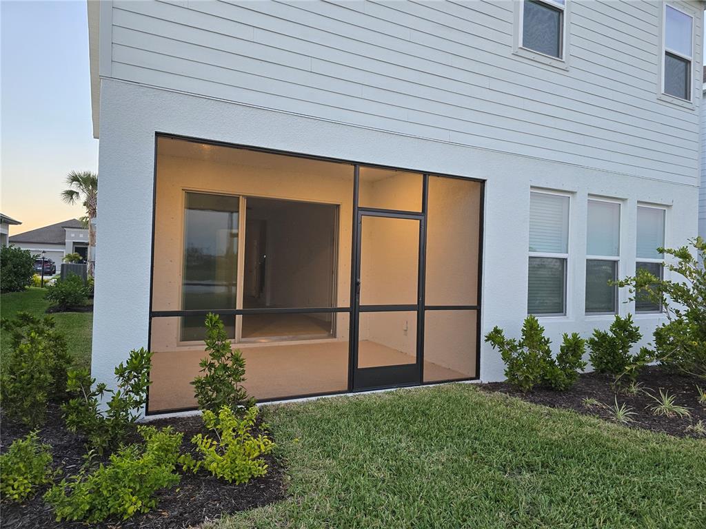 4233 Pond Brk Court Lakewood Ranch, FL 34211 - Photo 12 of 49 a front view of a house with a garden