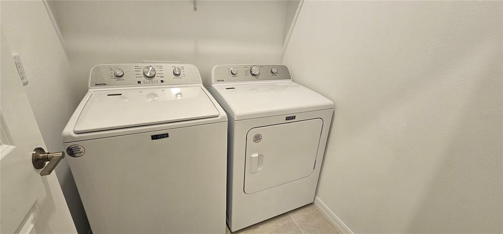 4233 Pond Brk Court Lakewood Ranch, FL 34211 - Photo 14 of 49 a utility room with dryer and washer