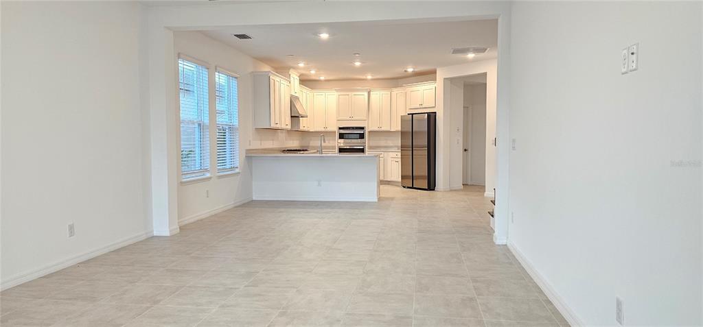 4233 Pond Brk Court Lakewood Ranch, FL 34211 - Photo 17 of 49 a view of kitchen with kitchen island and stainless steel appliances