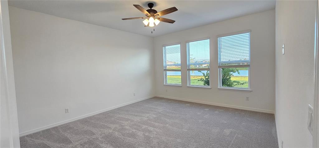 4233 Pond Brk Court Lakewood Ranch, FL 34211 - Photo 18 of 49 a view of an empty room with a window
