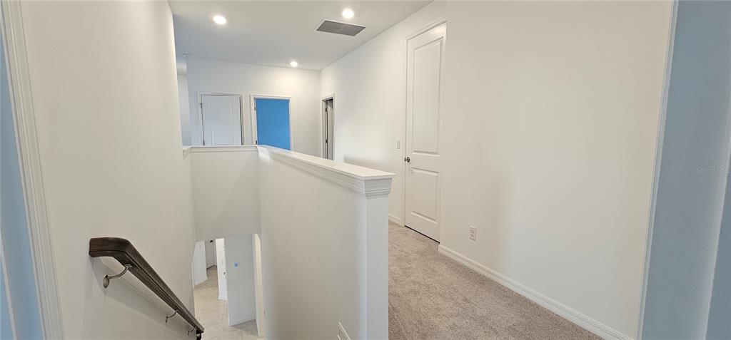 4233 Pond Brk Court Lakewood Ranch, FL 34211 - Photo 23 of 49 a view of hallway with stairs