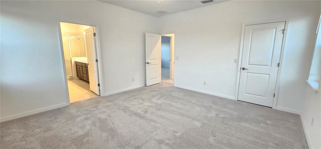 4233 Pond Brk Court Lakewood Ranch, FL 34211 - Photo 27 of 49 a view of an empty room with a window
