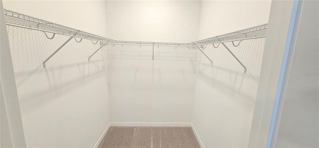 4233 Pond Brk Court Lakewood Ranch, FL 34211 - Photo 28 of 49 a view of walk in closet