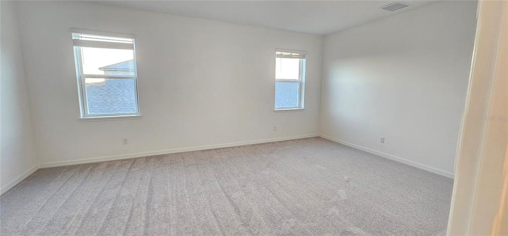 4233 Pond Brk Court Lakewood Ranch, FL 34211 - Photo 29 of 49 an empty room with a window