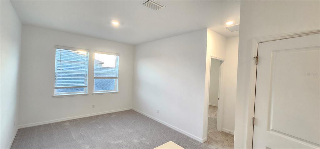 4233 Pond Brk Court Lakewood Ranch, FL 34211 - Photo 33 of 49 a view of an empty room with a window