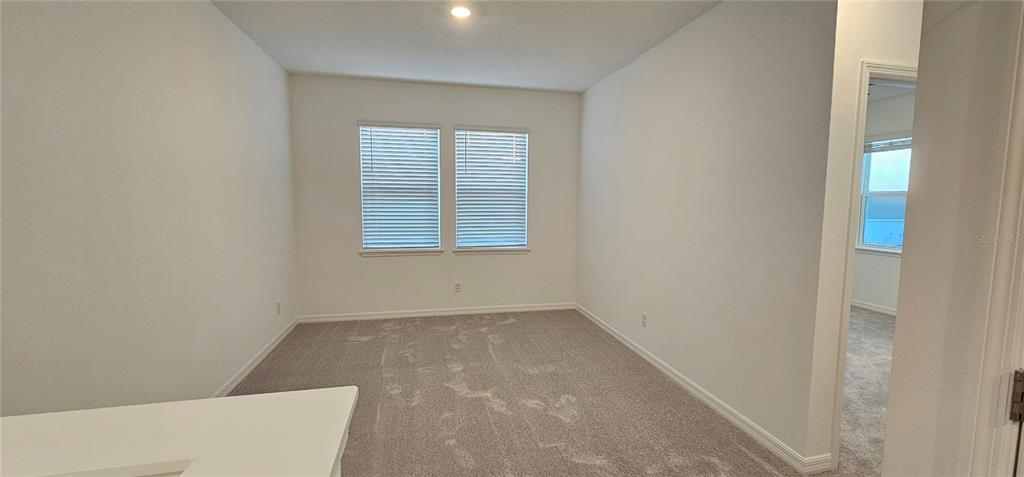 4233 Pond Brk Court Lakewood Ranch, FL 34211 - Photo 34 of 49 an empty room with windows