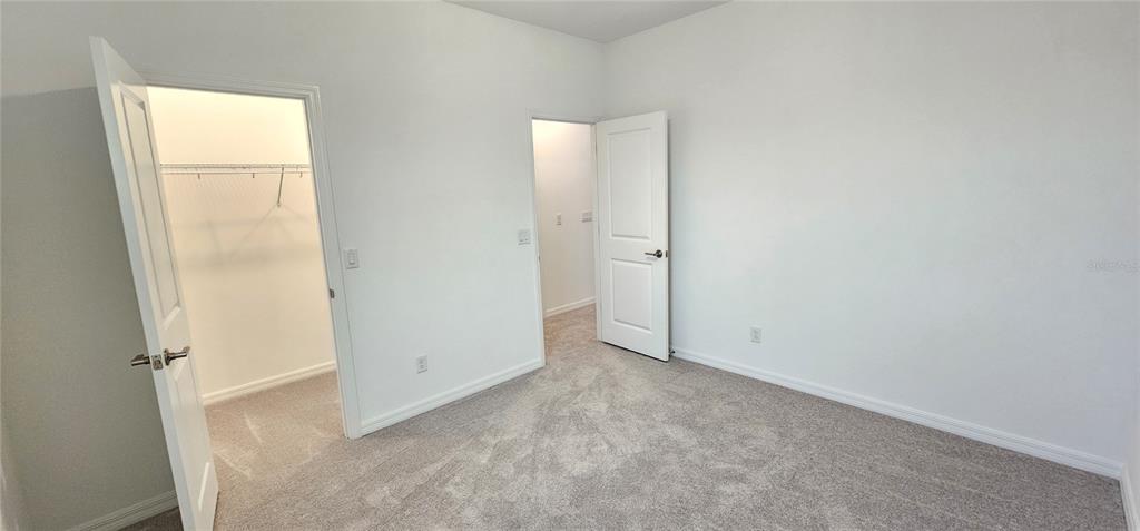 4233 Pond Brk Court Lakewood Ranch, FL 34211 - Photo 38 of 49 an empty room with windows
