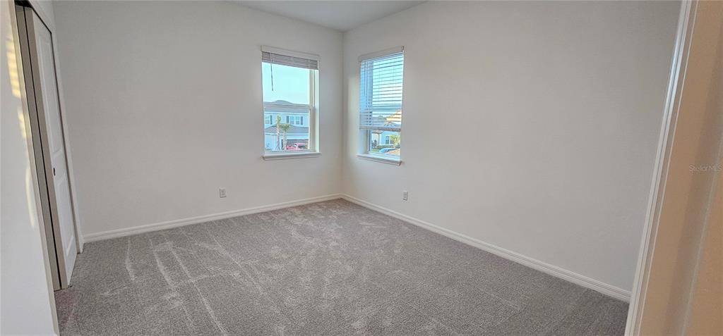 4233 Pond Brk Court Lakewood Ranch, FL 34211 - Photo 39 of 49 an empty room with windows