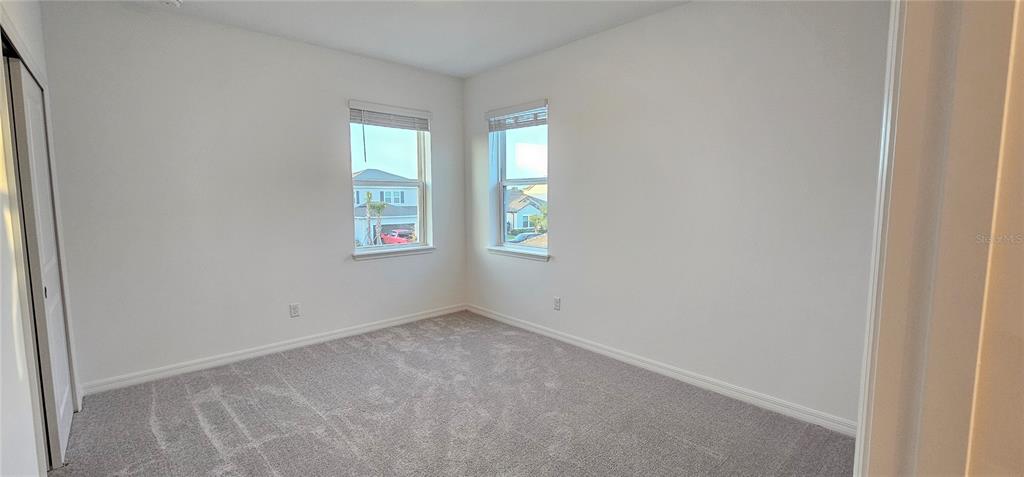 4233 Pond Brk Court Lakewood Ranch, FL 34211 - Photo 40 of 49 an empty room with windows
