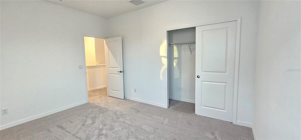 4233 Pond Brk Court Lakewood Ranch, FL 34211 - Photo 41 of 49 an empty room with closet and a bathroom