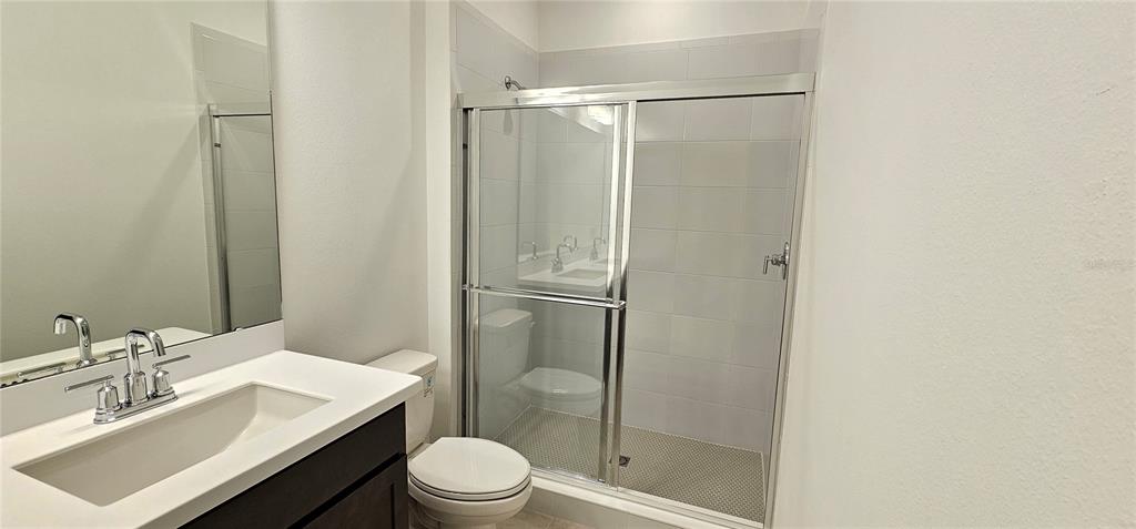 4233 Pond Brk Court Lakewood Ranch, FL 34211 - Photo 44 of 49 a bathroom with a sink toilet and shower