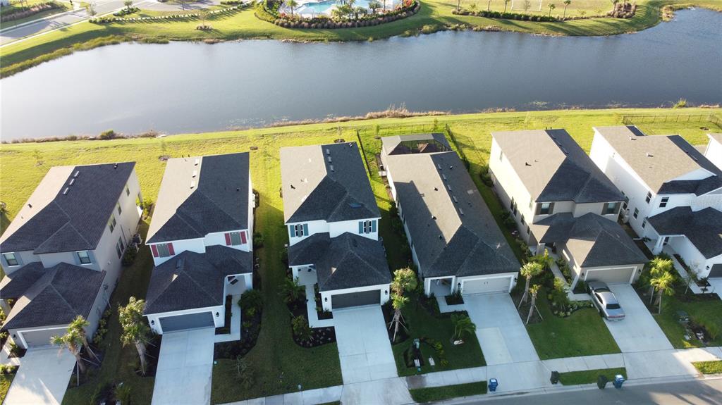 4233 Pond Brk Court Lakewood Ranch, FL 34211 - Photo 5 of 49 an aerial view of residential houses with outdoor space and swimming pool
