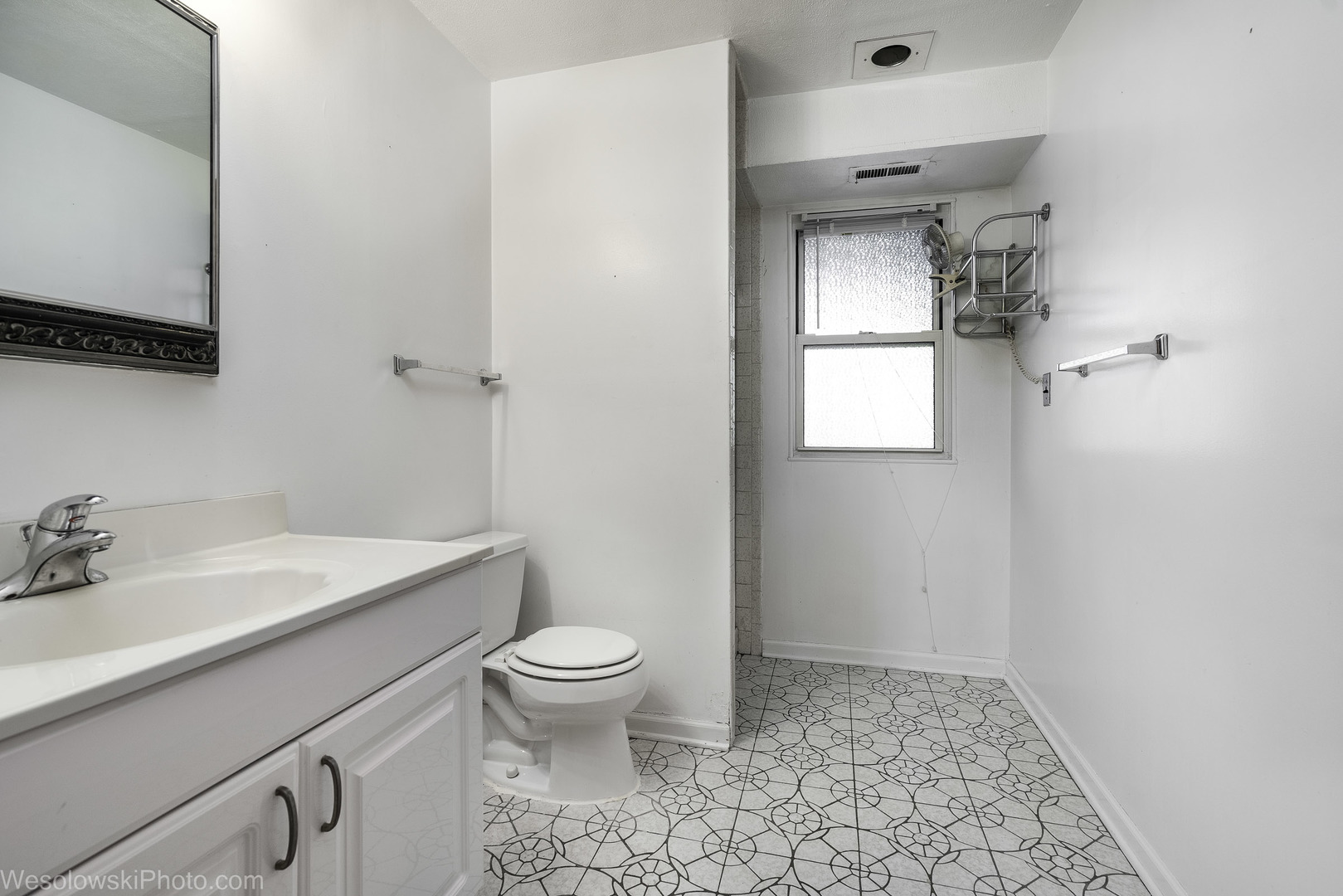 1822 West Catalpa Lane Mount Prospect, IL 60056 - Photo 19 of 24 a bathroom with a sink toilet and vanity