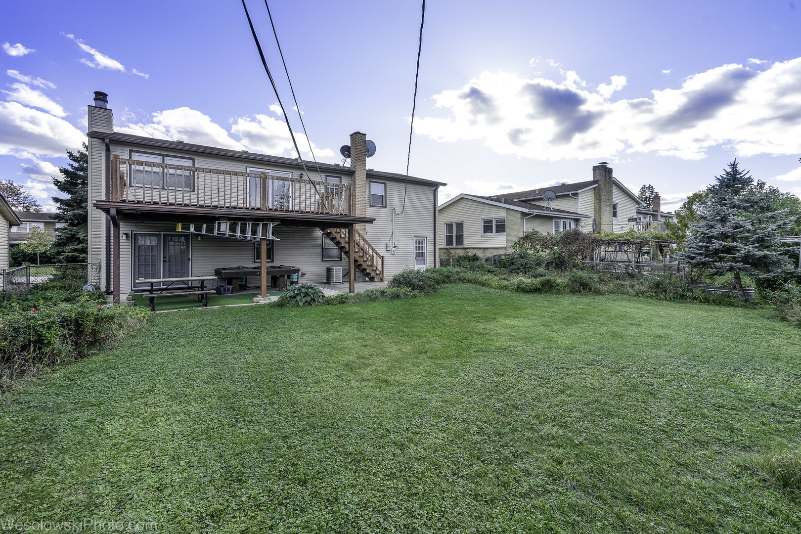 1822 West Catalpa Lane Mount Prospect, IL 60056 - Photo 24 of 24 a view of a house next to a big yard and large trees