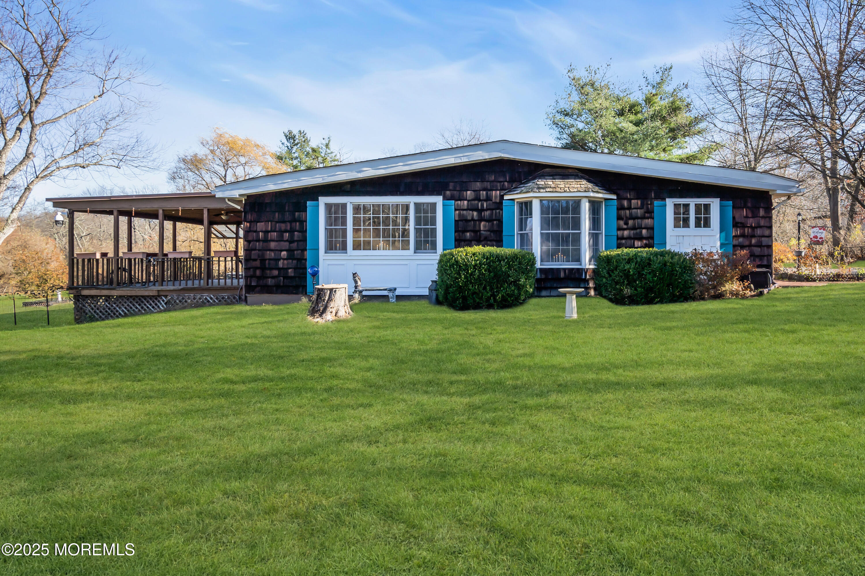 a view of a house with a yard and plants