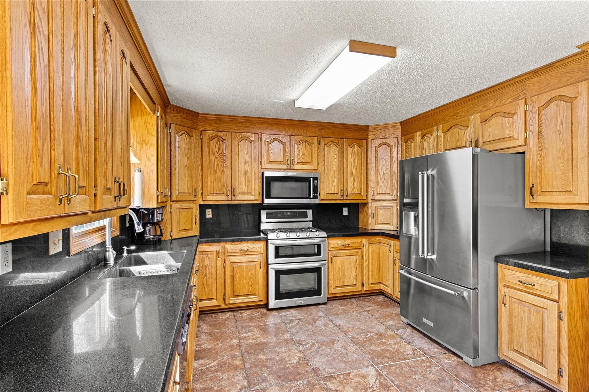 6145 Sharon Road, Unit 8 Salisbury, NC 28147 - Photo 13 of 41 a kitchen with stainless steel appliances a refrigerator a stove a sink and dishwasher