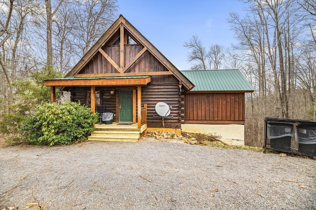 4130 Evans Chapel Road Sevierville, TN 37876 - Photo 1 of 33 a front view of a house with a yard and garage