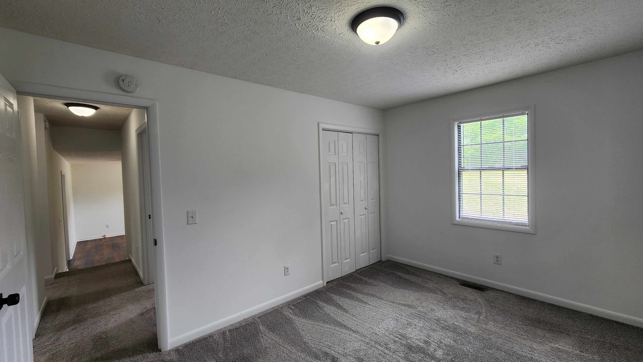 1825 Free Hill Road Celina, TN 38551 - Photo 12 of 49 an empty room with windows and closet