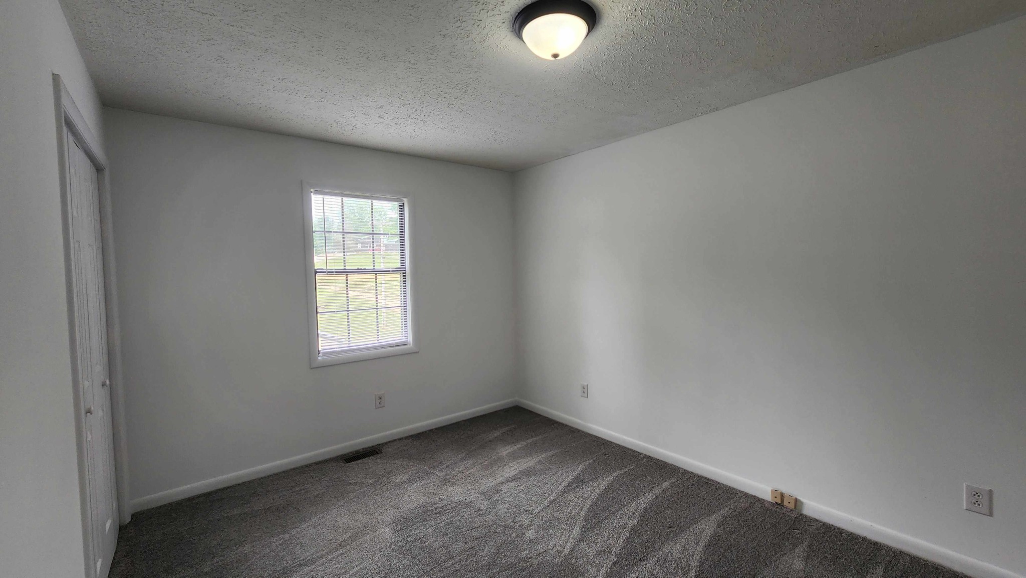 1825 Free Hill Road Celina, TN 38551 - Photo 13 of 49 an empty room with a window