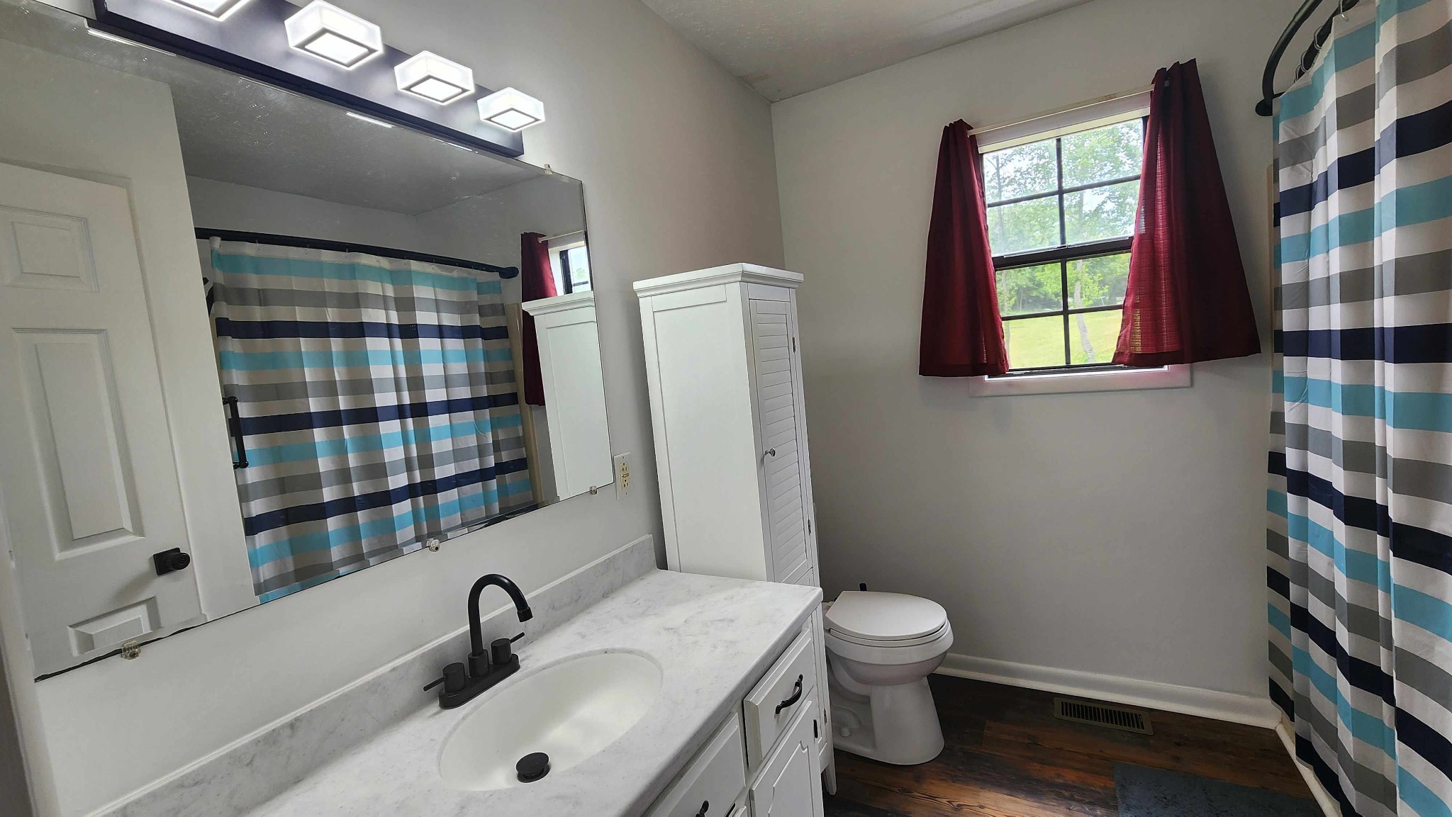 1825 Free Hill Road Celina, TN 38551 - Photo 17 of 49 a bathroom with a sink toilet and shower