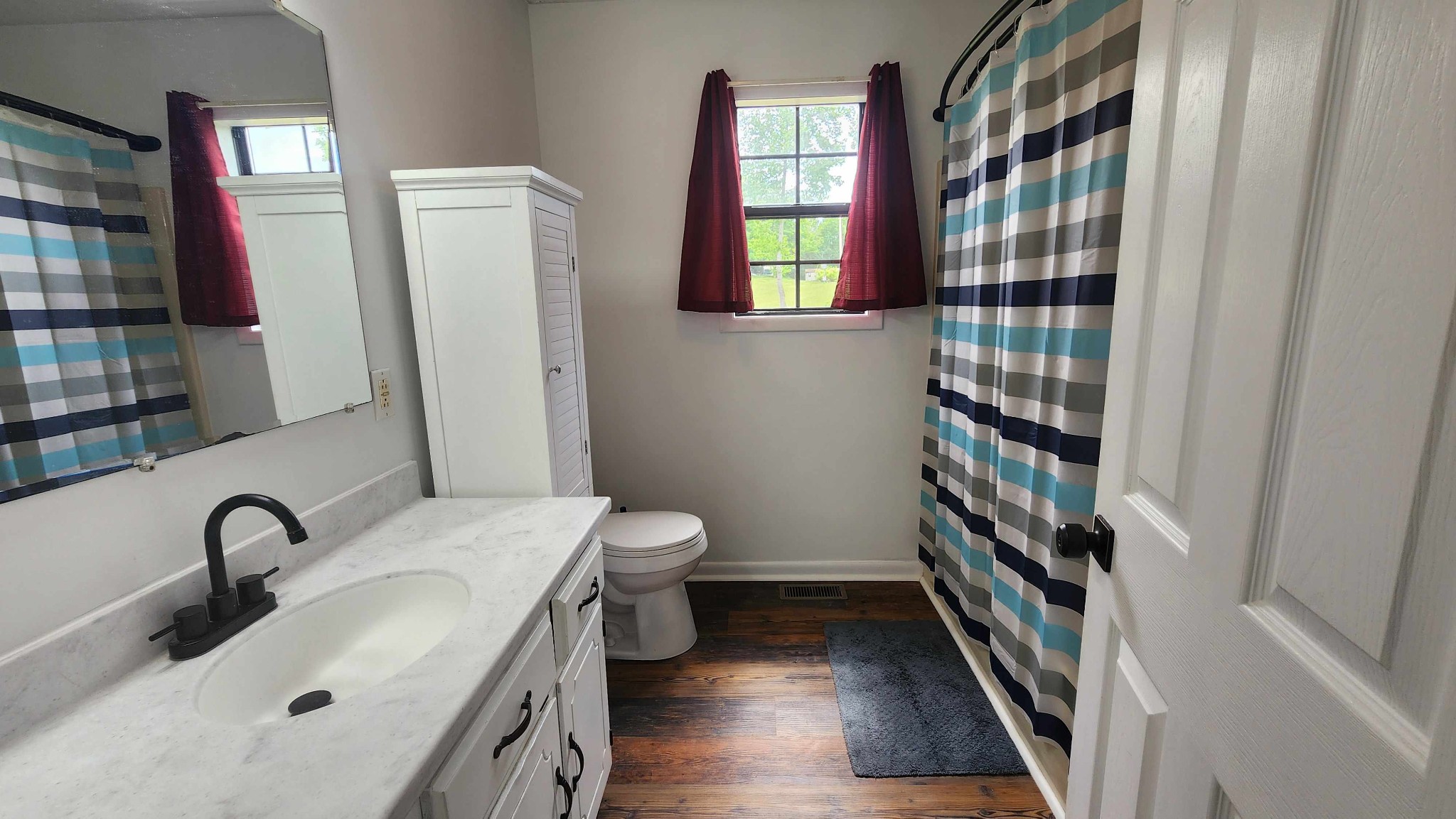 1825 Free Hill Road Celina, TN 38551 - Photo 18 of 49 a bathroom with a sink toilet and shower