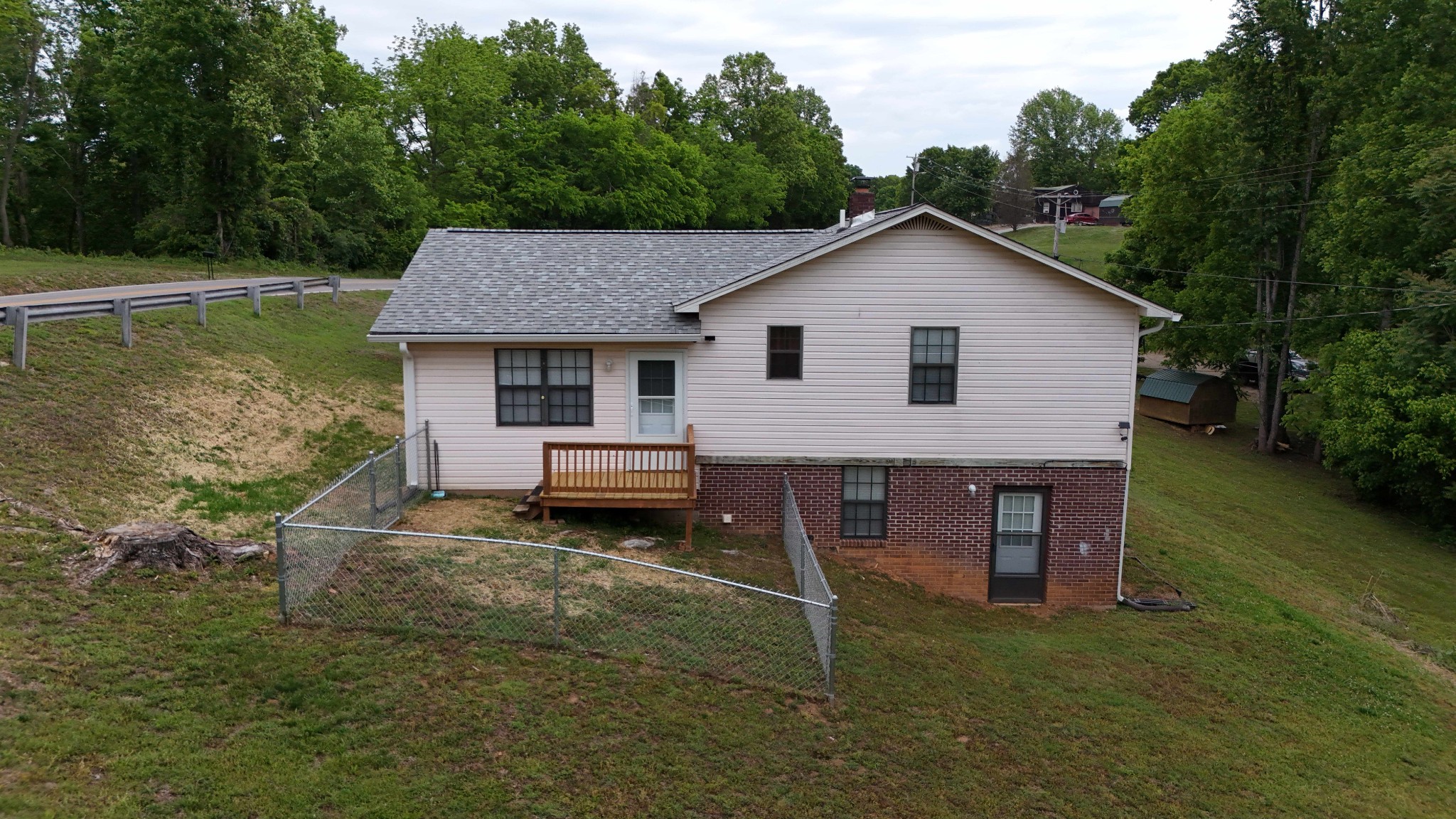 1825 Free Hill Road Celina, TN 38551 - Photo 30 of 49 a view of a house with a yard and sitting area