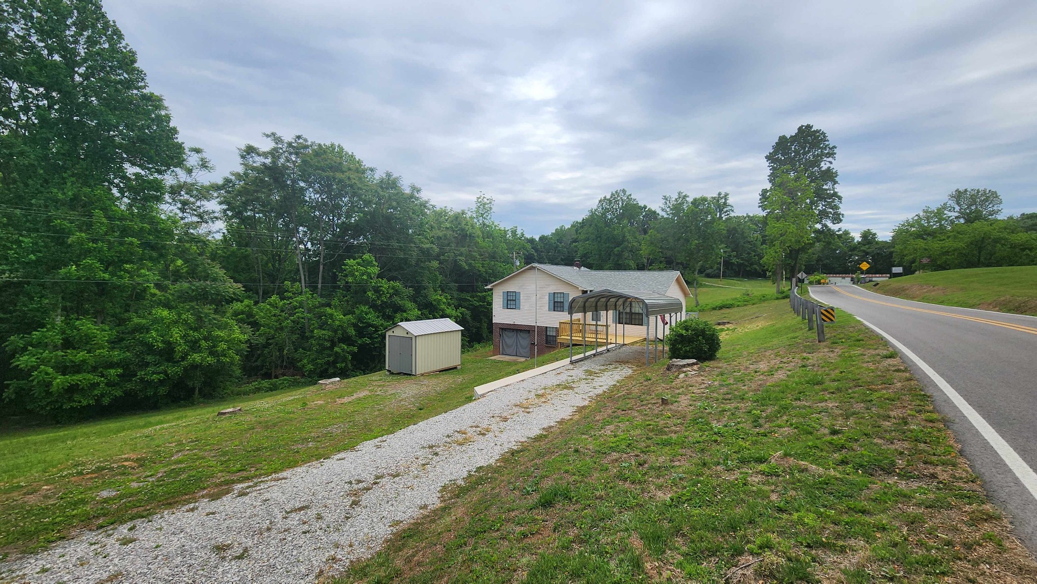 1825 Free Hill Road Celina, TN 38551 - Photo 36 of 49 a front view of a house with a yard