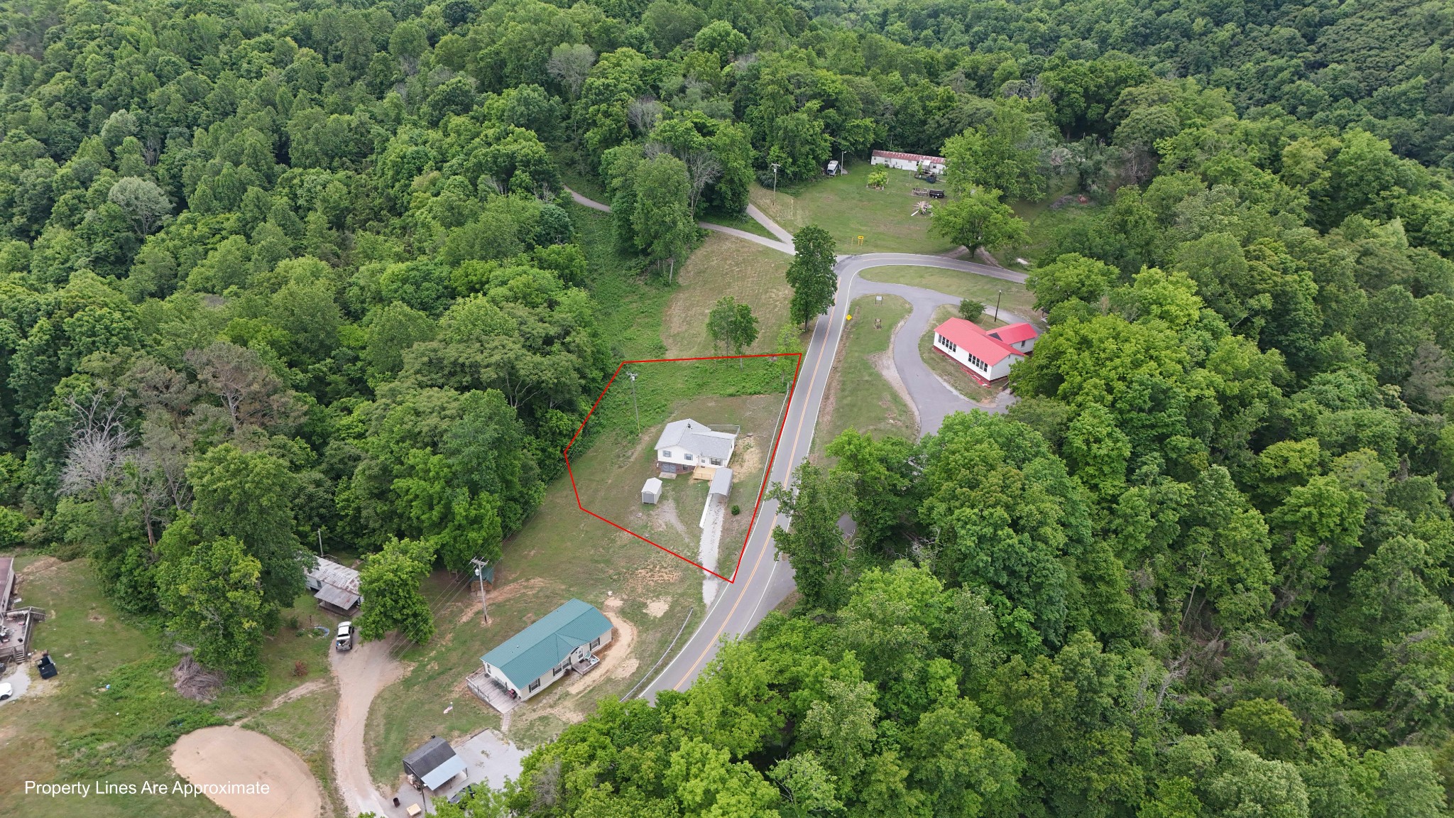 1825 Free Hill Road Celina, TN 38551 - Photo 42 of 49 an aerial view of residential house with outdoor space and trees all around