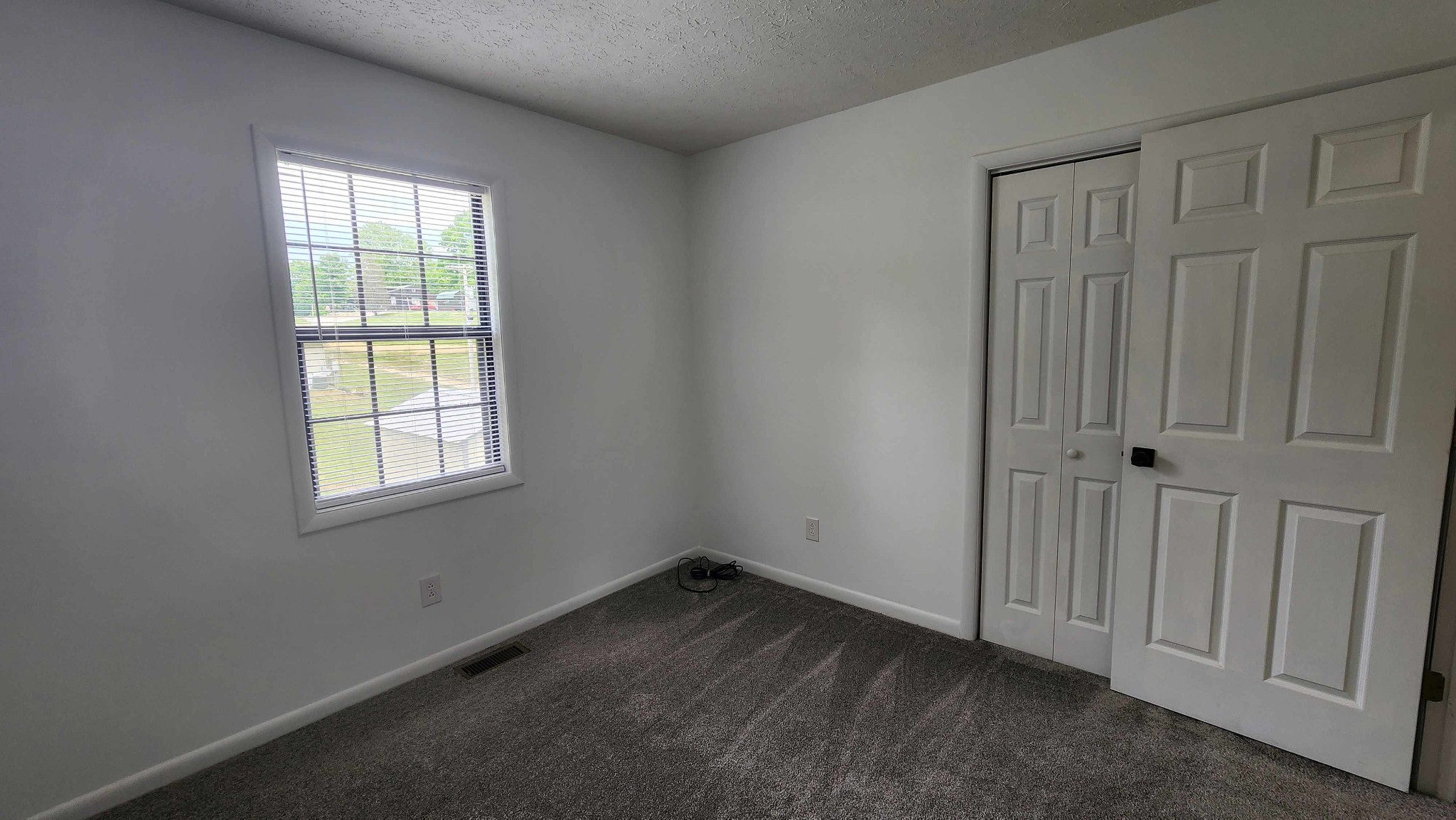 1825 Free Hill Road Celina, TN 38551 - Photo 7 of 49 an empty room with a window