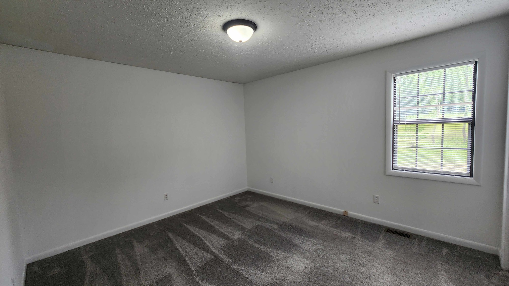 1825 Free Hill Road Celina, TN 38551 - Photo 8 of 49 an empty room with a empty space and window