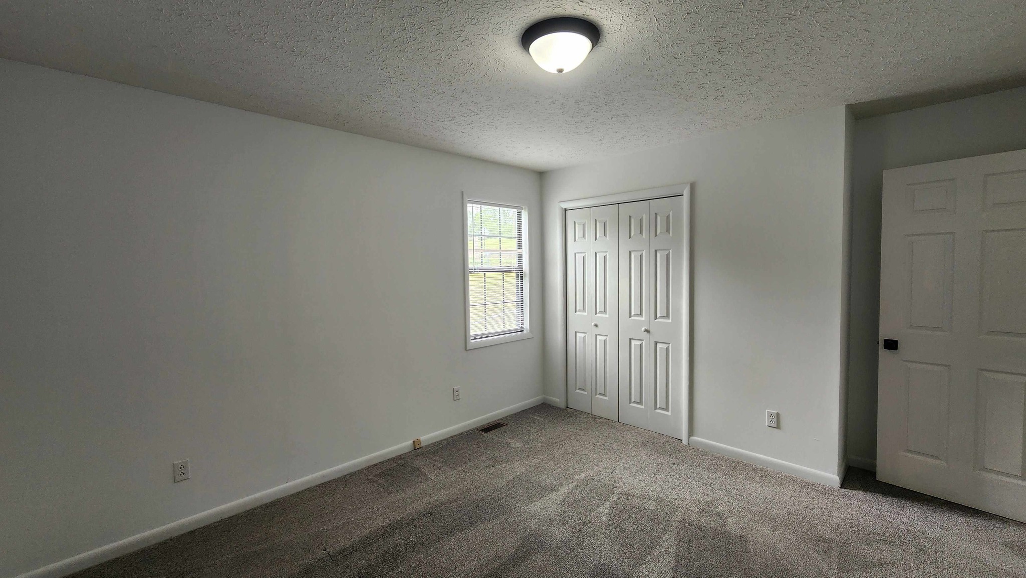 1825 Free Hill Road Celina, TN 38551 - Photo 9 of 49 an empty room with windows