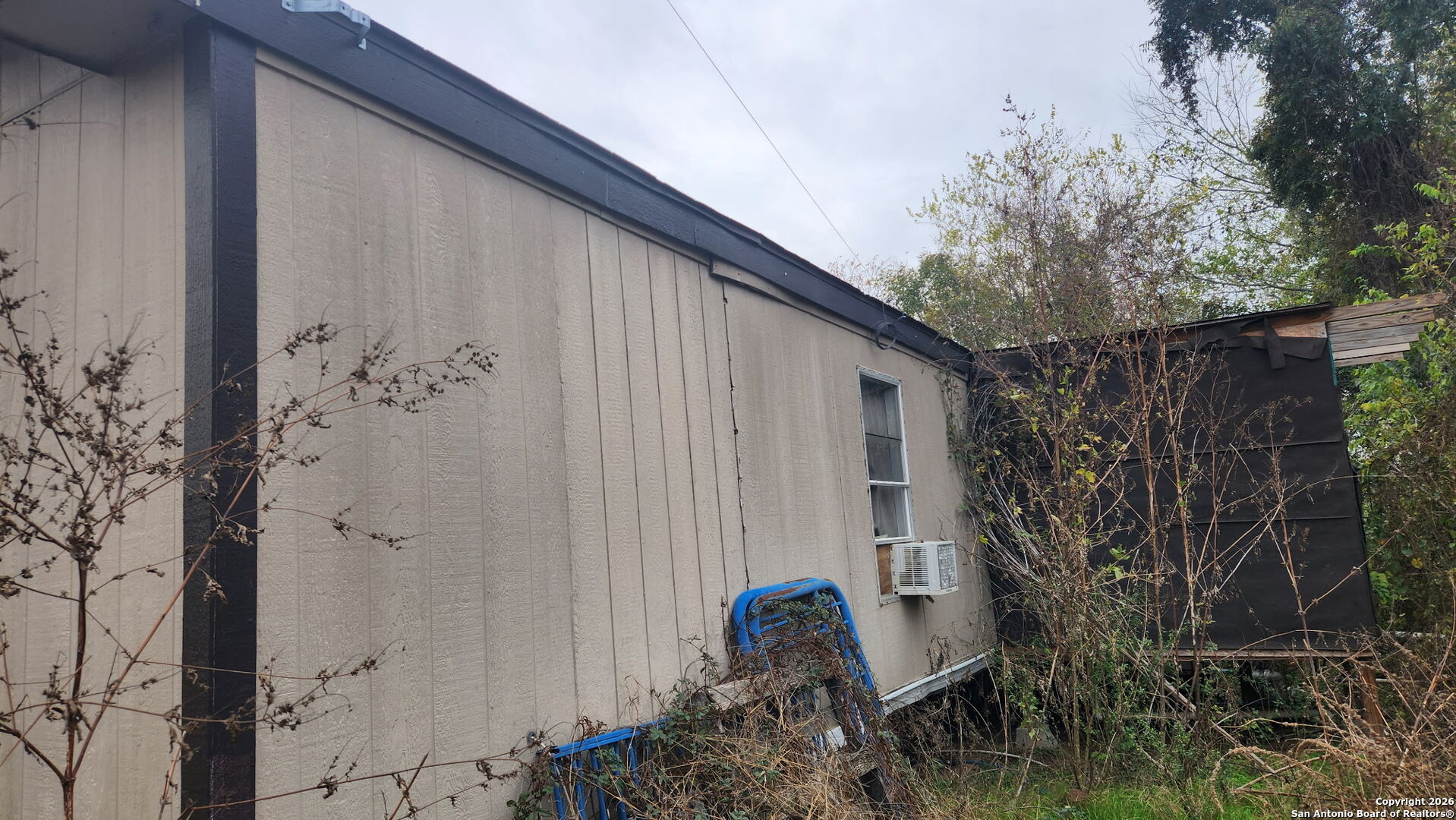 12815 Kenagy Road Atascosa, TX 78002 - Photo 3 of 10 a couple of chairs sitting in front of door