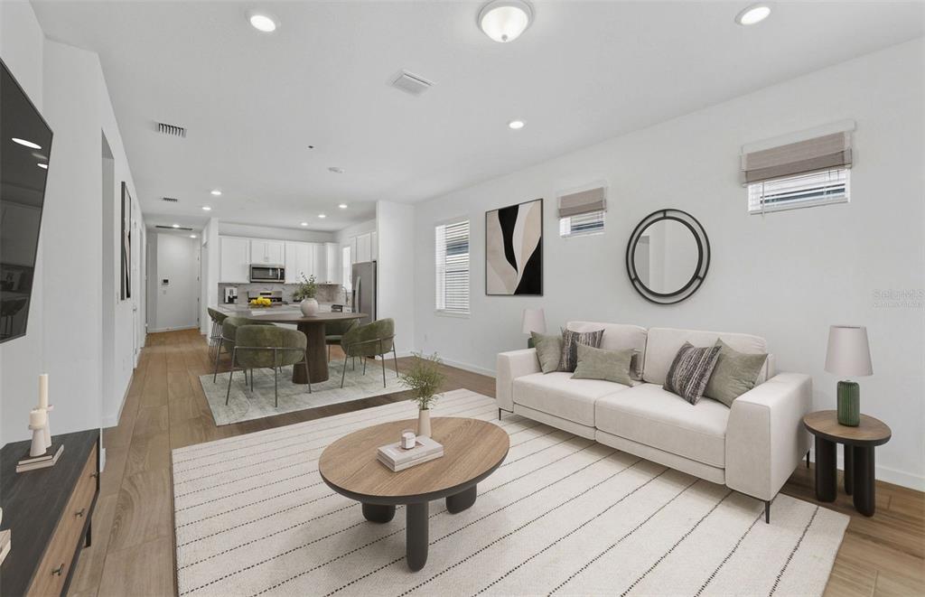 13764 Rocky Pne Place Spring Hill, FL 34610 - Photo 2 of 29 a living room with furniture a rug and white walls
