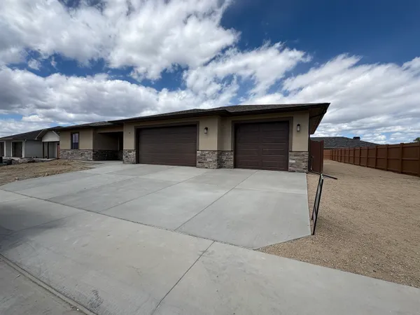 a front view of a house with yard
