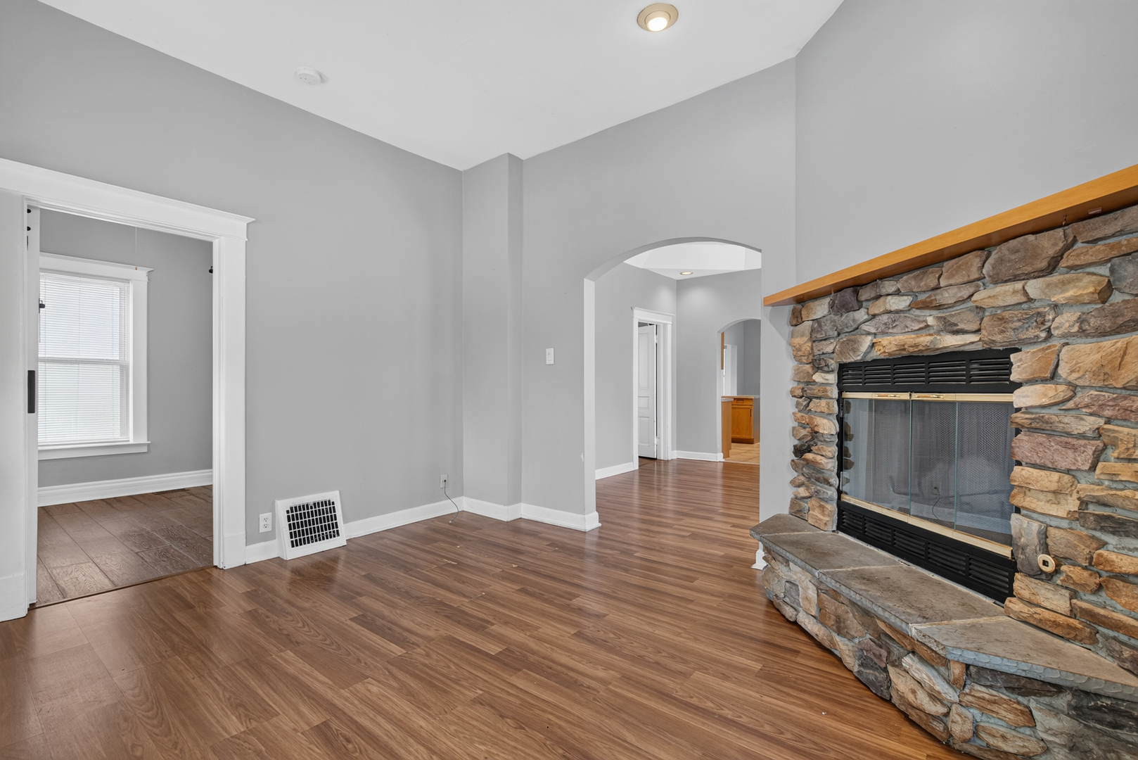 1128 Butler Street Morris, IL 60450 - Photo 9 of 28 a view of empty room with wooden floor and fireplace