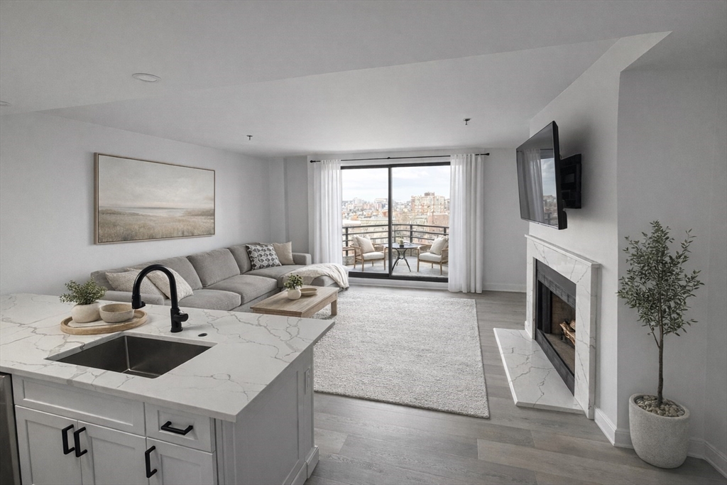 a living room with furniture a fireplace and flat screen tv