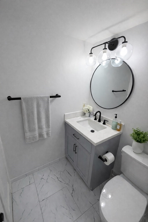 390 Commonwealth Avenue, Unit 809 Boston, MA 02215 - Photo 4 of 11 a bathroom with a sink vanity and mirror