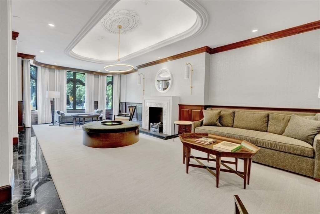 390 Commonwealth Avenue, Unit 809 Boston, MA 02215 - Photo 7 of 11 a living room with furniture and a large window