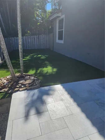a view of backyard with tub