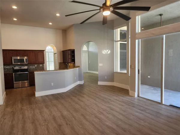 a view of a kitchen with a sink and a microwave