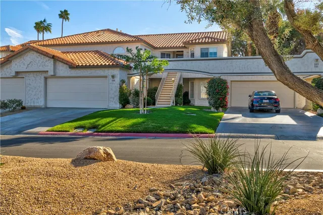 a view of front of house with a yard