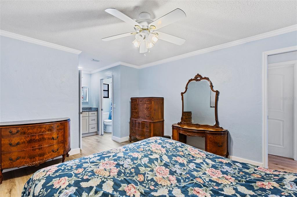 1855 Pine Tree Drive Edgewater, FL 32141 - Photo 20 of 26 a bedroom with bed and wooden floor