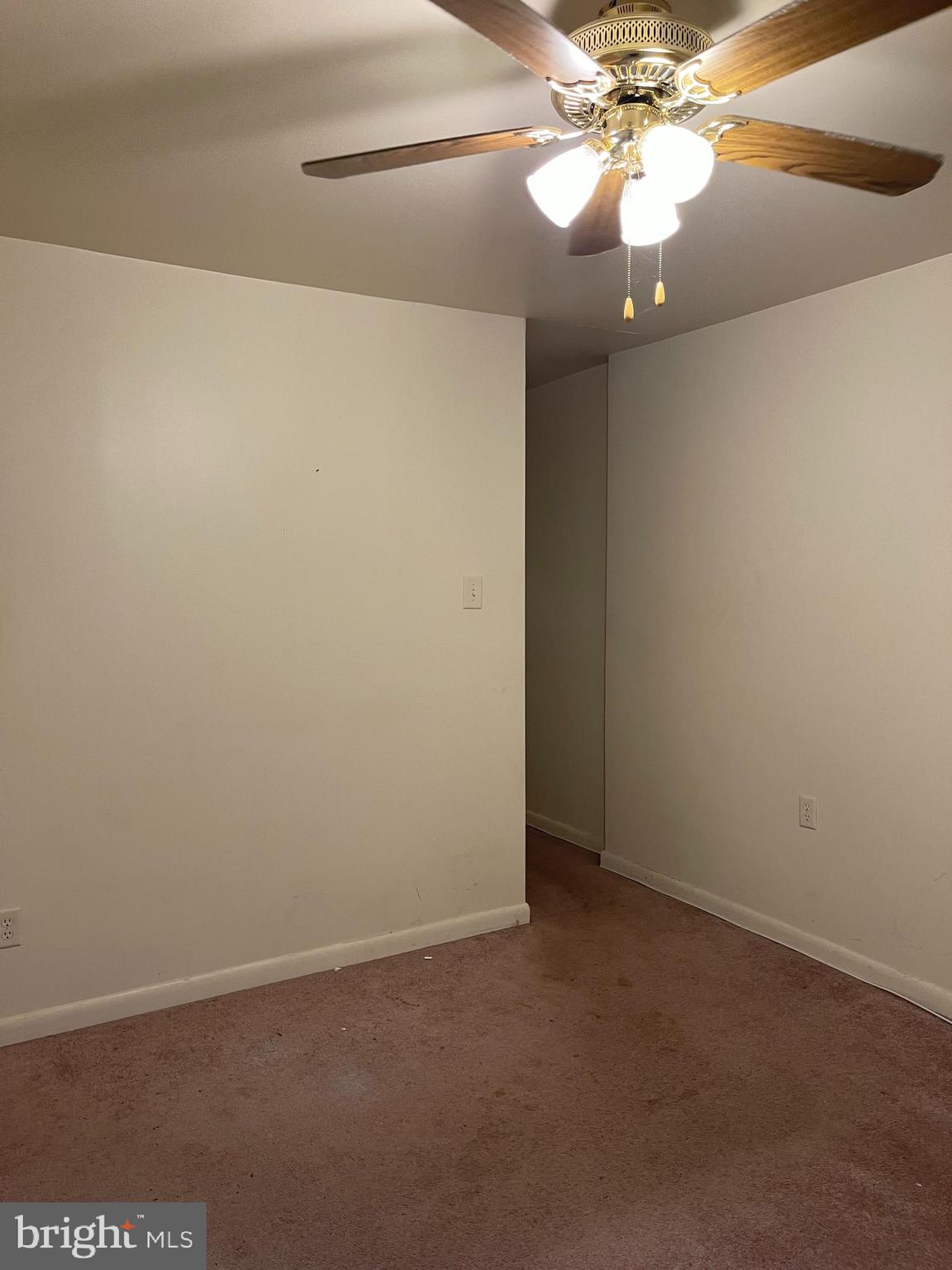 7968 Telegraph Road Severn, MD 21144 - Photo 15 of 26 a view of an empty room with a chandelier fan